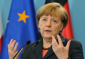 German Chancellor Angela Merkel gestures during a press conference after talks with Polish Prime Minister Donald Tusk, in Warsaw, Poland, Wednesday, March 12, 2014. (AP Photo/Alik Keplicz)