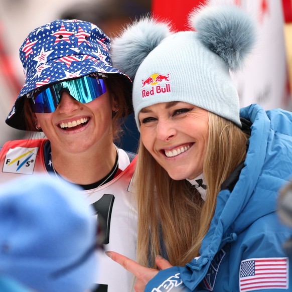 epa11820058 (L-R) Breezy Johnson, Lauren Macuga, and Lindsey Vonn of USA pose for a photo after Women&#039;s Super G race of the FIS Alpine Skiing World Cup stop in St. Anton, Austria, 12 January 2025 ...