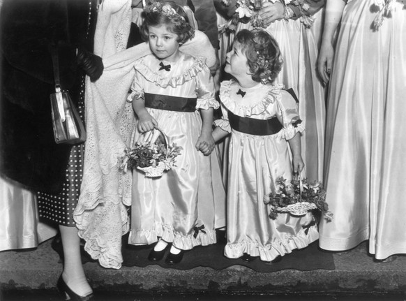 Bridesmaids and sisters 4-year-old Camilla and 3-year-old Annabelle Shand, at the wedding of Jeremy Cubitt and Diana du Cane in St Mark&#039;s church, North Audley Street, London, January 17, 1952. (P ...