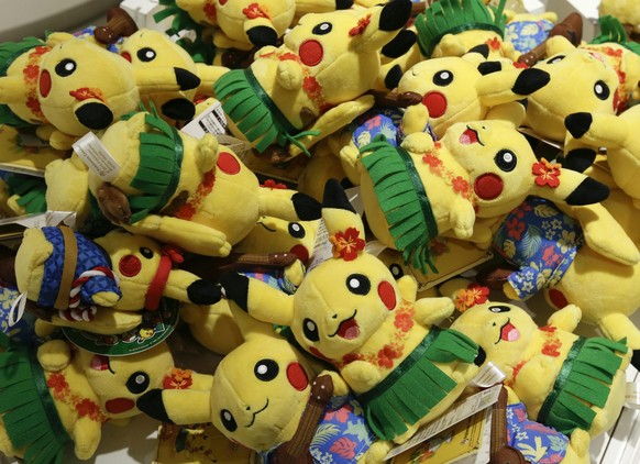 epa05433140 Stuffed Pikachu toys, a Pokemon fictional character, are piled at a Pokemon Center in Tokyo, Japan, 20 July 2016. Japanese videogame company Nintendo&#039;s hit-mobile game Pokemon Go may  ...