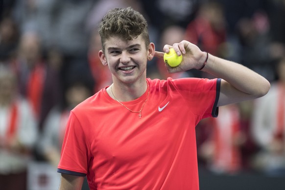 Switzerland&#039;s Jerome Kym in action against Russia&#039;s Evgeny Donskoy, and Andrey Rublev during the double match of the Davis Cup qualification final round between Switzerland and Russia at the ...