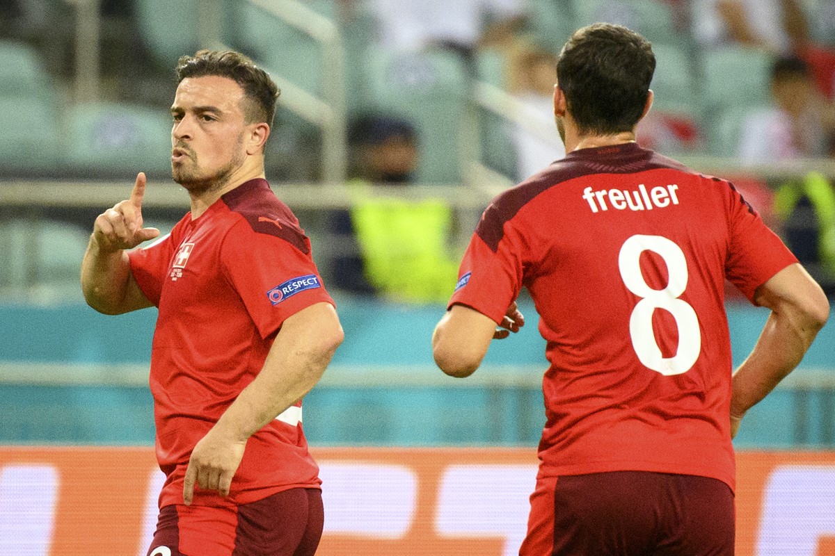Switzerland's midfielder Xherdan Shaqiri, left, celebrates the second goal with Switzerland's midfielder Remo Freuler, right, during the Euro 2020 soccer tournament group A match between Swi ...