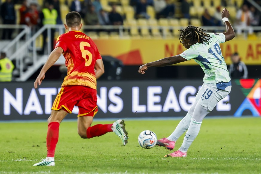 epa13265542 North Macedonia's Visar Musliu (L) and Switzerland's Winsley Boteli in action during the UEFA Nations League soccer match between North Macedonia and Switzerland in Skopje, North ...