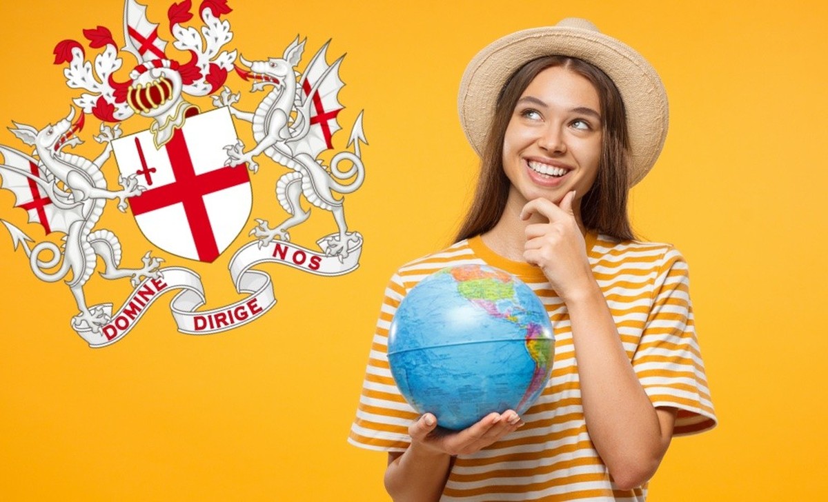 Young female dreaming about future trip, holding globe with one hand, isolated on yellow background. Travel concept.