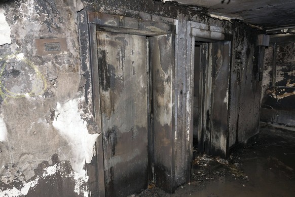 epa06036316 An undated handout photo made available by Britain&#039;s London Metropolitan Police Service (MPS) on 18 June 2017 shows a view on a burnt-out elevators inside the Grenfell Tower, a 24-sto ...