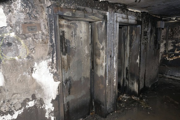 epa06036316 An undated handout photo made available by Britain&#039;s London Metropolitan Police Service (MPS) on 18 June 2017 shows a view on a burnt-out elevators inside the Grenfell Tower, a 24-sto ...