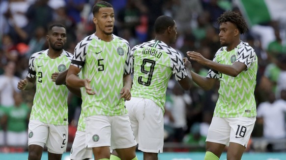 Nigeria&#039;s Alex Iwobi, right, celebrates with teammates after scoring his side&#039;s opening goal during a friendly soccer match between England and Nigeria at Wembley stadium in London, Saturday ...