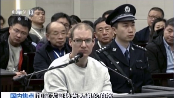 In this image taken from a video footage run by China&#039;s CCTV, Canadian Robert Lloyd Schellenberg attends his retrial at the Dalian Intermediate People&#039;s Court in Dalian, northeastern China&# ...