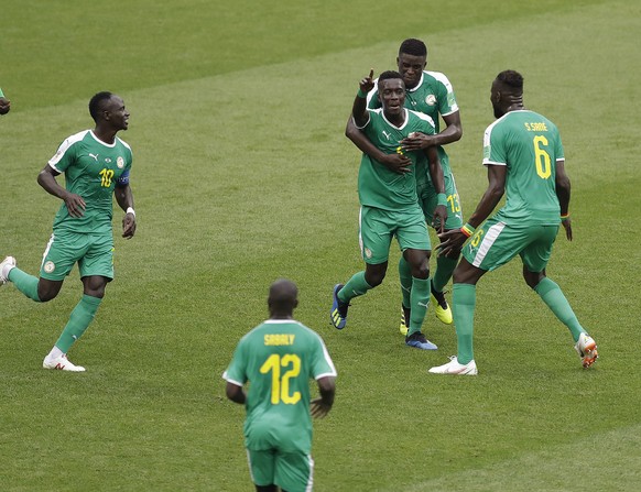 Senegal&#039;s players celebrate their opening by Senegal&#039;s Idrissa Gana Gueye, third right, goal with Senegal&#039;s Sadio Mane during the group H match between Poland and Senegal at the 2018 so ...