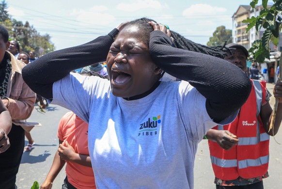 People react in the Kibera neighborhood of Nairobi, Kenya, to the death of Kenya former prime minister Raila Odinga Wednesday, Oct. 15, 2025. Odinga died of a heart attack in Indiaat the age of 80. (A ...