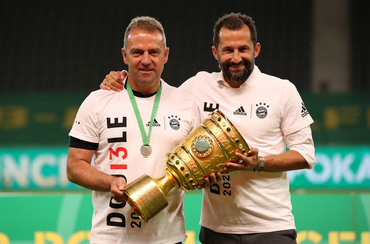 epa08527807 Bayern Munich's head coach Hansi Flick (L) and sports director Hasan Salihamidzic (R) pose with the trophy after winning the German DFB Cup final between Bayer 04 Leverkusen and FC Ba ...