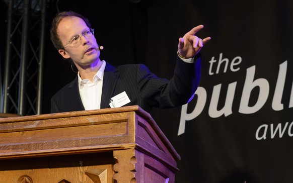 Oliver Classen, former campaign coordinator Public Eye Award and media director at the Berne Declaration, speaks next to a grave with WEF RIP 1971-2015 on it during the Public Eye Lifetime Award cerem ...