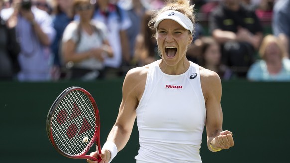 Viktorija Golubic of Switzerland celebrates after winning her first round match against Iga Swiatek of Poland, at the All England Lawn Tennis Championships in Wimbledon, London, on Monday, July 1, 201 ...