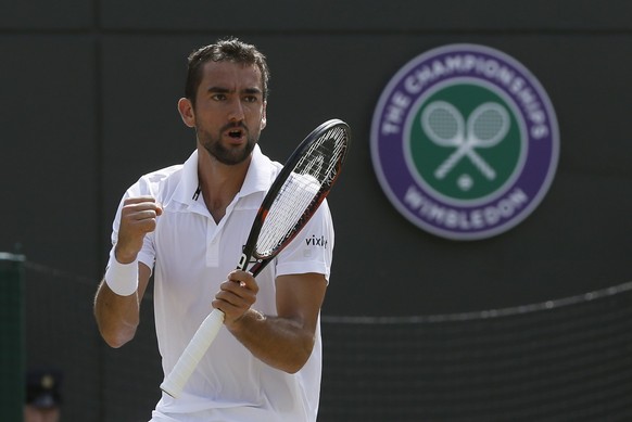 Croatia&#039;s Marin Cilic celebrates winning a second set against Steve Johnson of the United States during their Men&#039;s Singles Match on day five at the Wimbledon Tennis Championships in London  ...