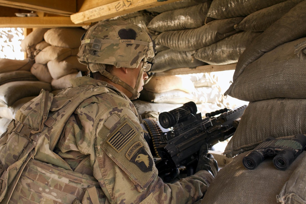 In this Sept. 8, 2016 photo, a U.S. Army soldier guards a position at Camp Swift, northern Iraq. U.S. troops will be engaged more closely than ever in fighting against Islamic State group militants as ...