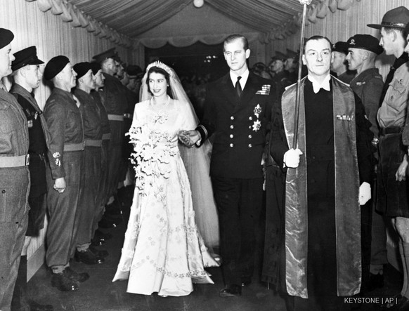 FILE - In this Nov. 20, 1947 file photo, Britain&#039;s Princess Elizabeth and her husband the Duke of Edinburgh are seen leaving Westminster Abbey, London following their wedding service. Will she or ...