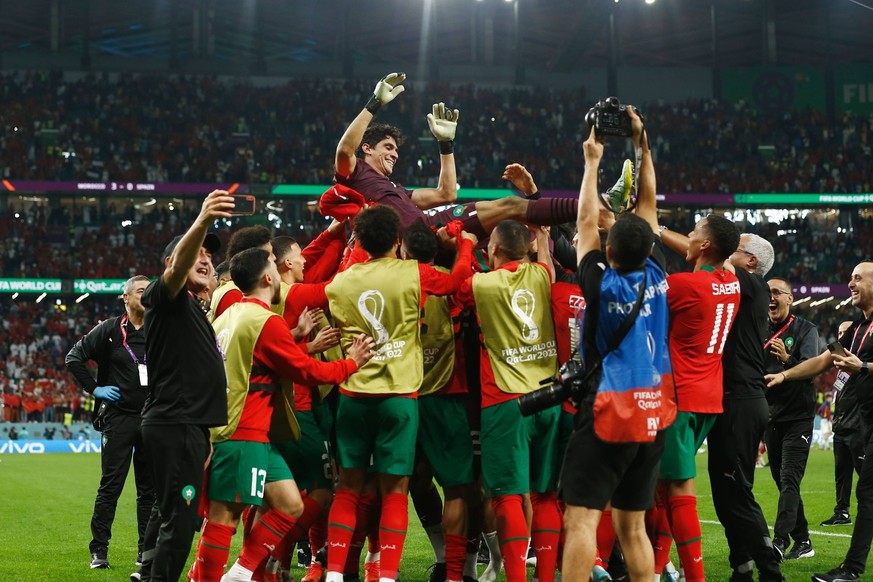 Yassine Bounou MAR, DECEMBER 6, 2022 - Football / Soccer : Bounou is lifted up after winning the penalty shootout of FIFA World Cup, WM, Weltmeisterschaft, Fussball Qatar 2022 Round of 16 match betwee ...