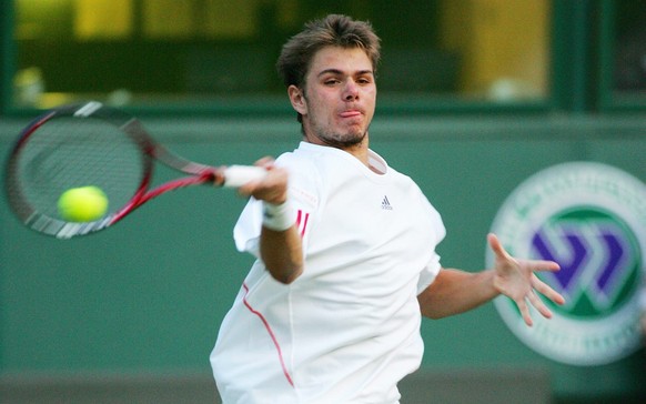 Stanislas Wawrinka of Switzerland returns to Mario Ancic of Croatia during their third round match for the Wimbledon Championships at the All England Lawn Tennis Club, Friday 30 June 2006. EPA/GERRY P ...