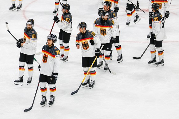 epa12960670 Players of Germany look disappointed after losing the 2026 IIHF Men's Ice Hockey World Championship preliminary round group A game between Finland and Germany, in Zurich, Switzerland, ...