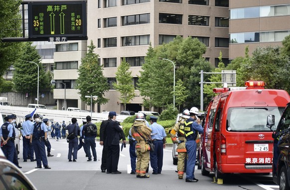 Police and firefighters inspect the scene where a man is reported to set himself on fire, near the Prime Minister&#039;s Office in Tokyo, Wednesday, Sept. 21, 2022. The man was taken to a hospital Wed ...