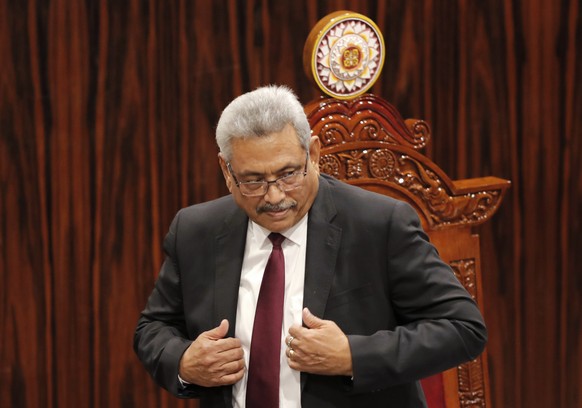 FILE - Sri Lankan President Gotabaya Rajapaksa leaves after addressing parliament during the ceremonial inauguration of the session, in Colombo, Sri Lanka on Jan. 3, 2020. The president of Sri Lanka f ...