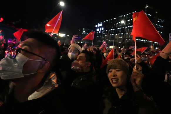 Revellers count down to the new year at the Shougang Park in Beijing, Sunday, Jan. 1, 2023. (AP Photo/Ng Han Guan)