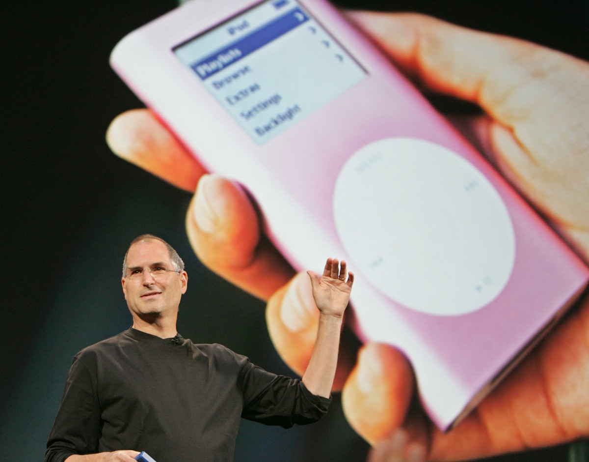 FILE - In this Aug. 4, 2005 file photo, Apple CEO Steve Jobs speaks during a launch event for Apple's music download service, iTunes, in Tokyo. A billion-dollar class-action lawsuit over Apple’s  ...