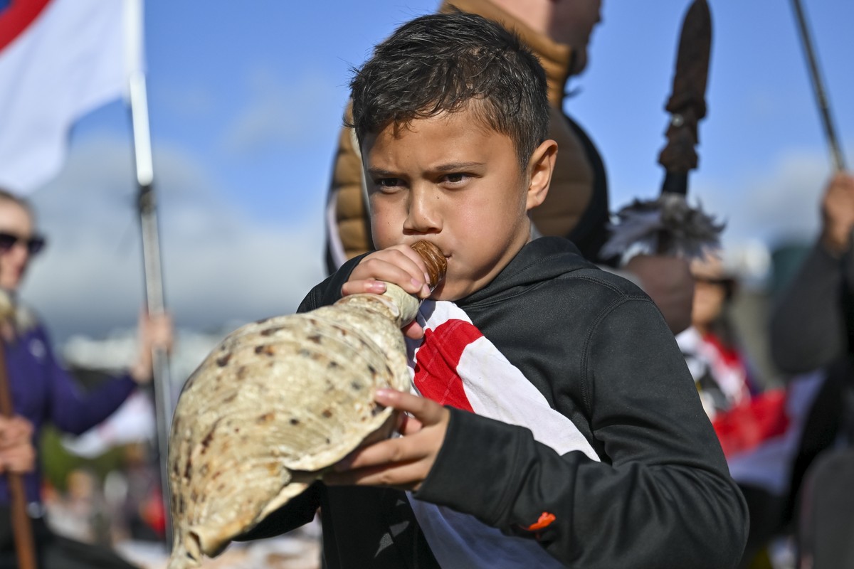 Te Hauk?nui Hokianga plays a conch shell ahead of a protest at New Zealand's parliament against a proposed law that would redefine the country's founding agreement between Indigenous M?ori a ...