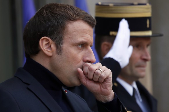 French President Emmanuel Macron waits for the arrival of European Council President Charles Michel prior to their meeting at the Elysee Palace, in Paris, Tuesday, Dec. 10, 2019. The two men discussed ...