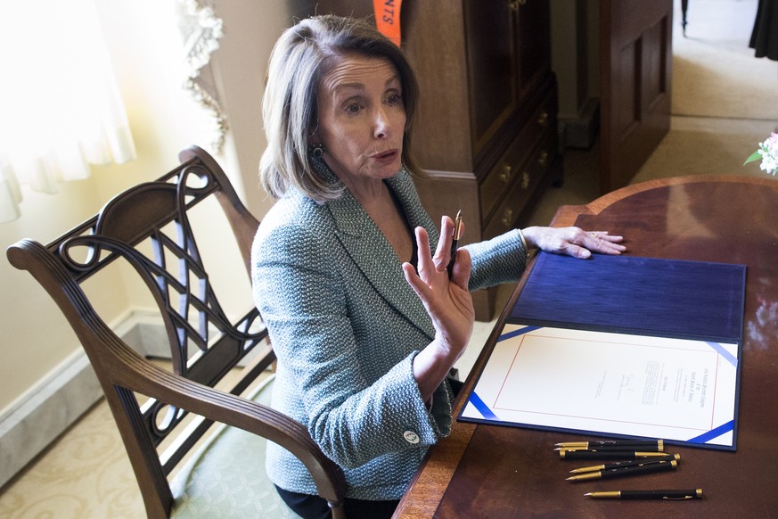 epa07437642 US Speaker of the House Nancy Pelosi holds an enrollment ceremony for a bill blocking US President Donald J. Trump&#039;s national emergency declaration, in her office on Capitol Hill in W ...