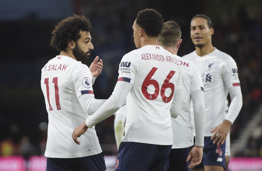 epa08051941 Mohamed Salah (L) of Liverpool celebrates with teammate Trent Alexander-Arnold (R) after scoring a goal during the English Premier League soccer match between Bournemouth and Liverpool in  ...