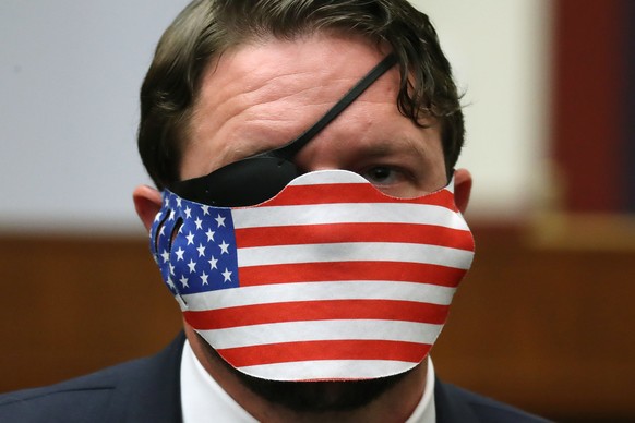 epa08676332 Wearing a face mask to reduce the risk posed by the coronavirus, House Homeland Security Committee member Rep. Dan Crenshaw (R-TX) attends a hearing about &#039;worldwide threats to the ho ...