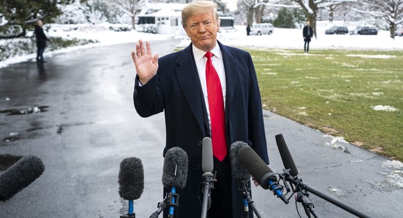 epa07283432 US President Donald J. Trump speaks about the Russia investigation and the partial government shutdown as he departs the White House to speak to a Farm Convention in New Orleans, in Washin ...