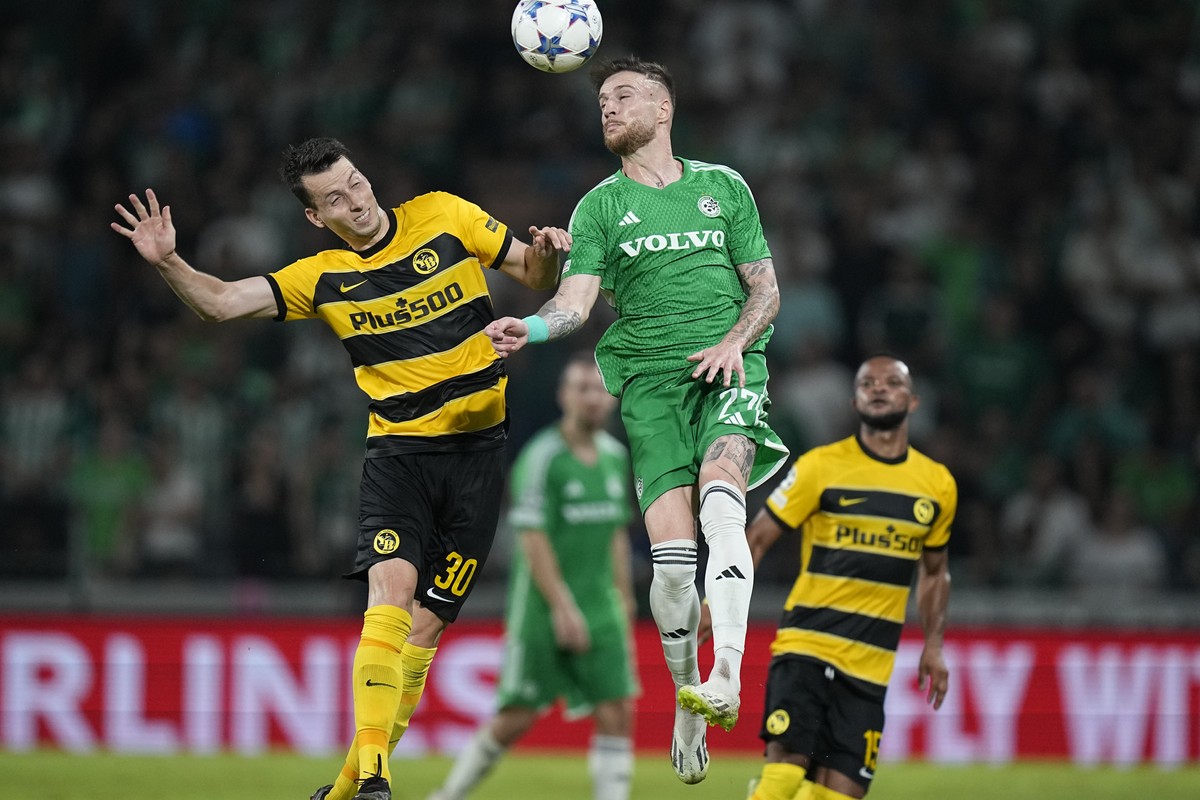 Sandro Lauper of Young Boys, left, and Maccabi Haifa's Pierre Cornud jump for the ball during the Champions League qualifying playoff first leg soccer match between Maccabi Haifa and Young Boys i ...