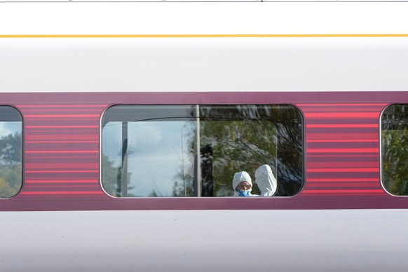 Forensic investigators are seen at the train after a mass stabbing on a London-bound train in Huntingdon, England, Sunday, Nov. 2, 2025.(AP Photo/Kirsty Wigglesworth)
Britain Train Stabbings