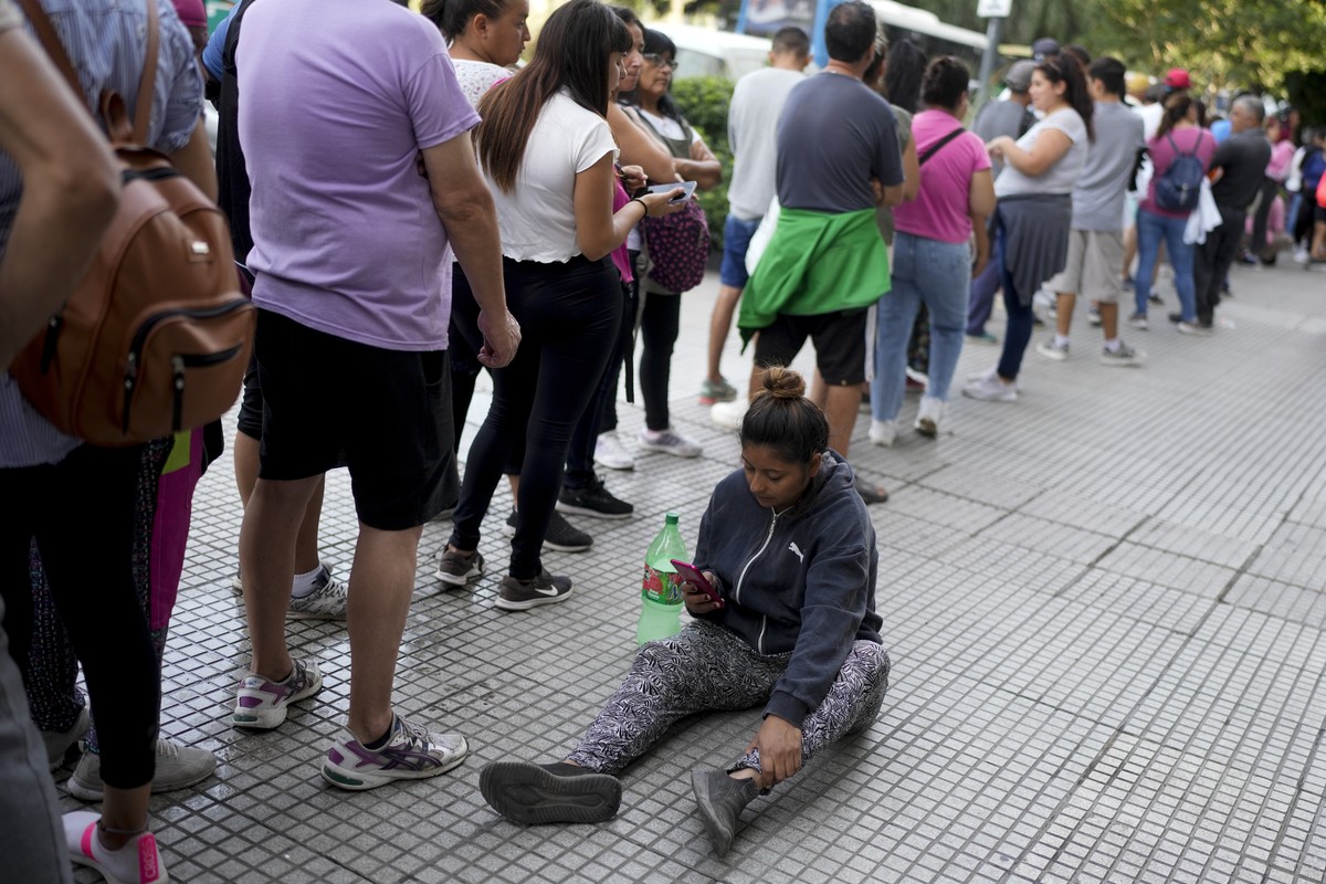 People line up outside the office of Human Capital Minister Sandra Pettovello, in response to the minister stating she will personally assist the hungry, in Buenos Aires, Argentina, Monday, Feb. 5, 20 ...