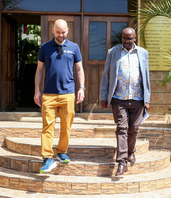 RECORD DATE NOT STATED NAIROBI, KENYA - - MARCH 22 Athletics Kenya Youth Development Director Barnabas Korir right leads Athletics Intergrity Unit Chief Executive Officer Brett Clothier out of Riadha  ...