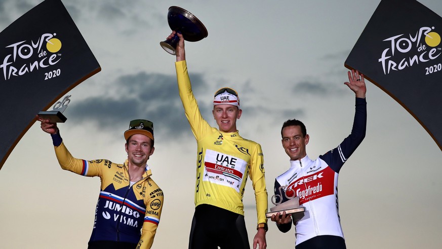 epa08684898 Second placed Slovenian rider Primoz Roglic of Jumbo-Visma team (L), first placed Slovenian rider Tadej Pogacar of the UAE Team Emirates (C) and third placed Australian rider Richie Porte  ...