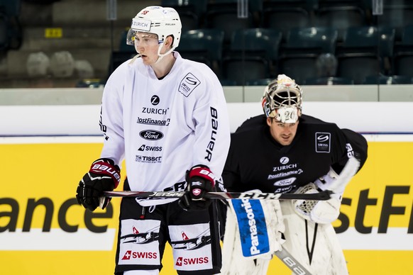 Switzerland&#039;s defender Janis Moser, left, reacts next to Switzerland&#039;s goaltender Reto Berra, right, during a training camp of Swiss national hockey team ahead the IIHF 2019 World Championsh ...