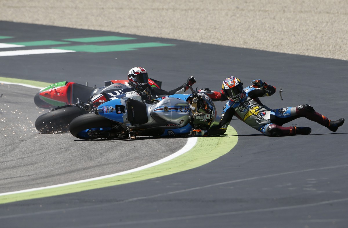 Australia's Jack Miller, right, France's Loris Baz crash during the Italy's Moto GP grand prix at the Mugello circuit, in Scarperia, Italy, Sunday, May 22, 2016. (AP Photo/Antonio Calan ...