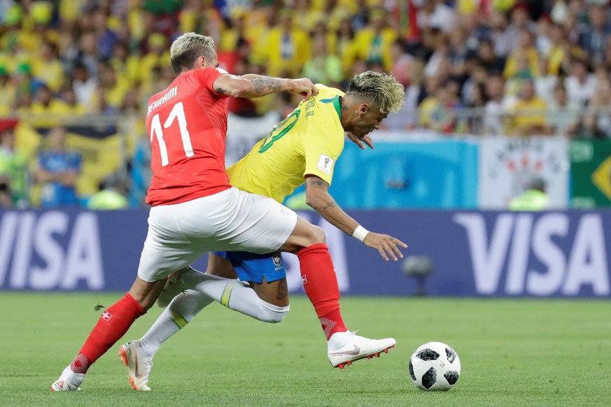 epa06816834 Brazilian forward Neymar (R) and Swiss midfielder Valon Behrami during the FIFA World Cup 2018 Group E soccer match between Brazil and Switzerland, in Rostov-On-Don, Russia, 17 June 2018. ...