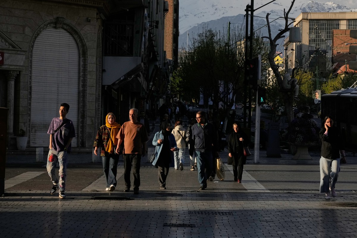 People cross an intersection in downtown Tehran, Iran, Monday, March 30, 2026. (AP Photo/Vahid Salemi)
Iran Daily Life