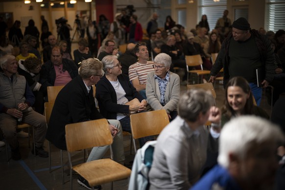 epa10619128 Residents of Brienz-Brinzauls attend an information meeting on the imminent evacuation of their village, in Tiefencastel, Switzerland, Tuesday 09 May 2023. The municipality has closed the  ...