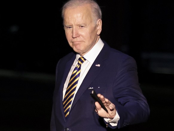 epa09811671 US President Joe Biden waves to photographers while walking on the South Lawn of the White House as he arrives after a trip to Fort Worth, Texas; in Washington, DC, USA, 08 March 2022. EPA ...