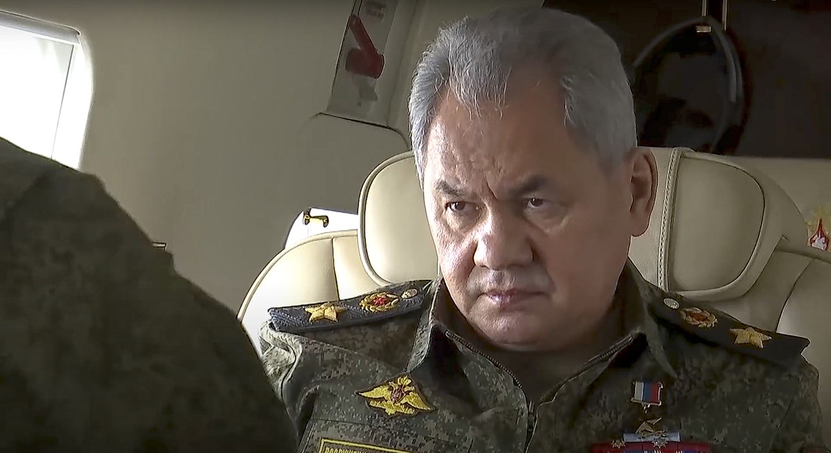 In this photo taken from video provided by the Russian Defense Ministry Press Service on Wednesday, Feb. 16, 2022, Russian Russian Defense Minister Sergei Shoigu , left, speaks to hight rang officers  ...