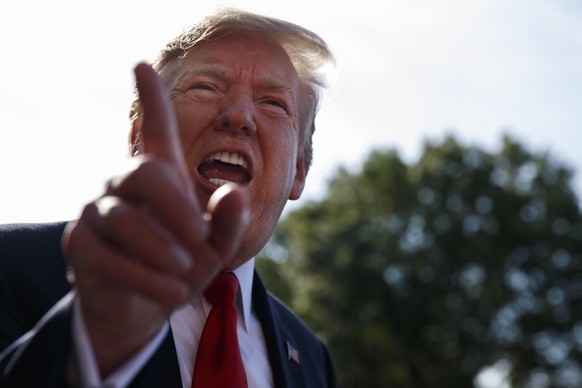 President Donald Trump talks with reporters before departing on Marine One for the Air Force Academy graduation ceremony, Thursday, May 30, 2019, in Washington. (AP Photo/Evan Vucci)