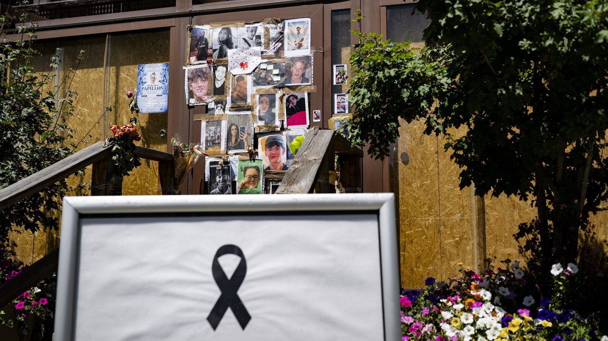 Portraits of the young victims are displayed at the entrance of the bar "Le Constellation" six moths later the deadly fire, in Crans-Montana, Switzerland, Thursday, July 9, 2026. Forty-one p ...