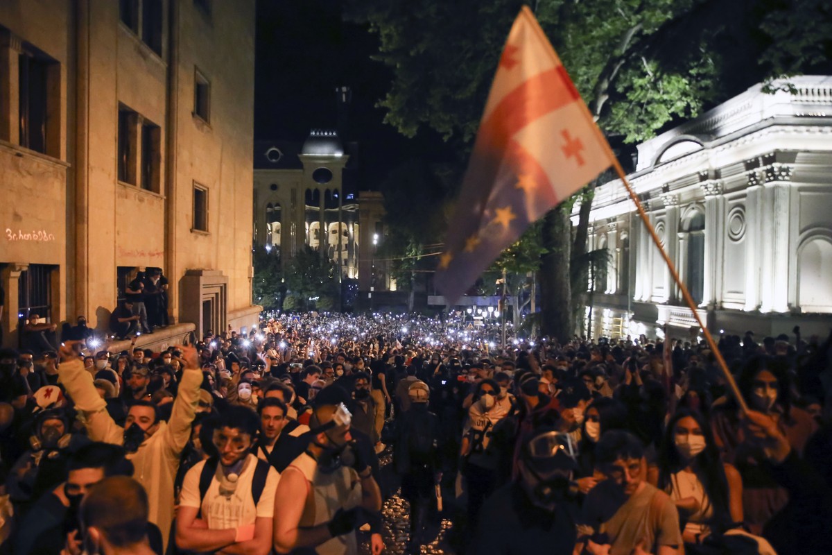 Demonstrators gather during an opposition protest against "the Russian law" near the Parliament building in Tbilisi, Georgia, early Thursday, May 2, 2024. Protesters denounce the bill as &qu ...