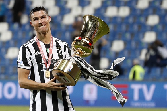 Juventus' Cristiano Ronaldo celebrates with the winner's trophy a victory against Atalanta after the end of Italian Cup soccer final match between Atalanta and Juventus at the Mapei Stadium ...