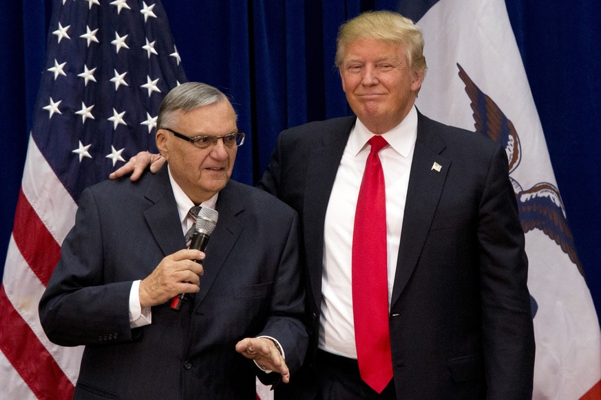 FILE - In this Jan. 26, 2016, photo, Republican presidential candidate Donald Trump is joined by Maricopa County, Ariz., Sheriff Joe Arpaio at a campaign event in Marshalltown, Iowa. Arpaio says he is ...